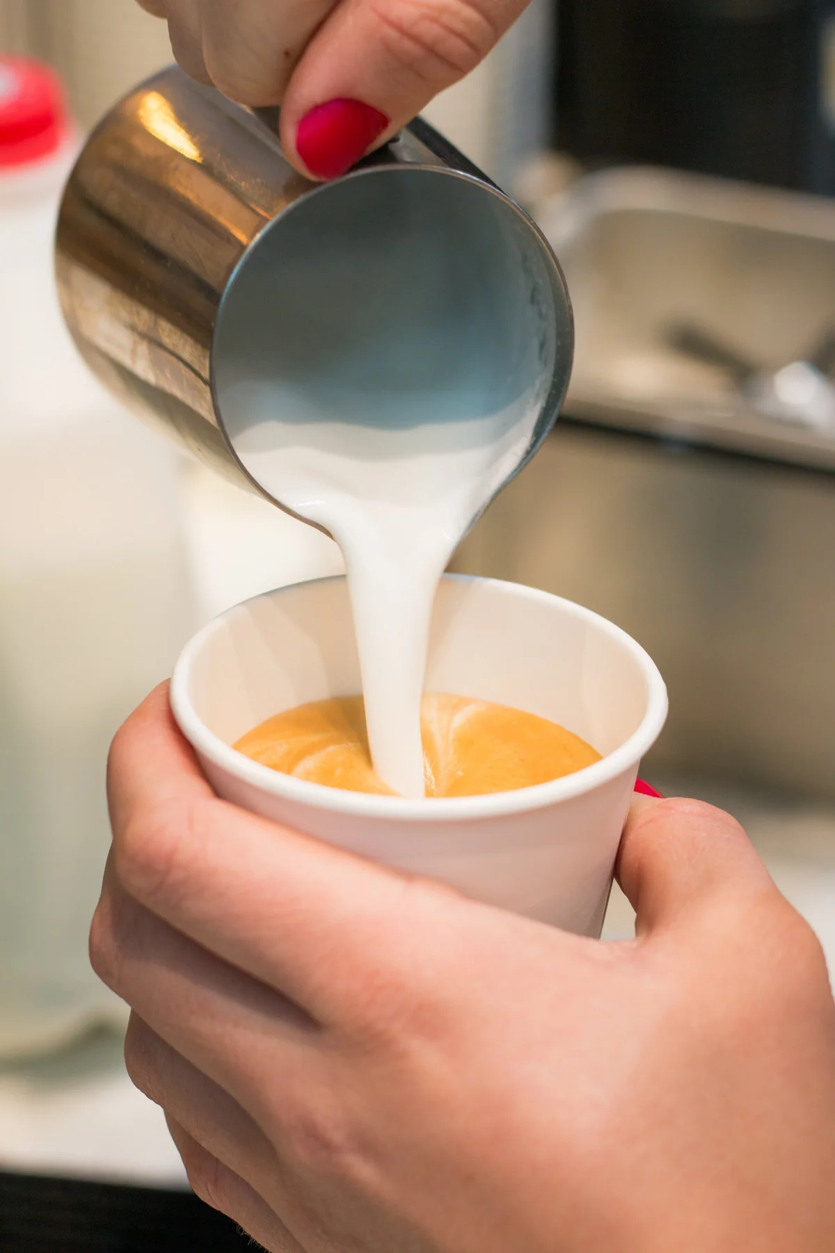 A barista preparing a Johnny Joe coffee drink.